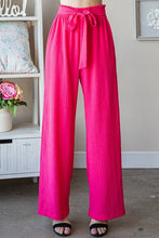 Bright pink heimish full size tie pants with paperbag waistband and matching fabric tie at the waist plus size