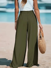 Olive green drawstring wide-leg pants with high waist and elastic waistband for comfortable fit