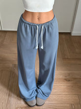 Light blue drawstring wide leg pants with adjustable drawstring waist and elastic waistband for comfortable wear