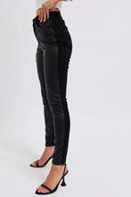 Black high-waisted judy blue plus size skinny pants with a sleek faux leather glossy panel down the outer leg