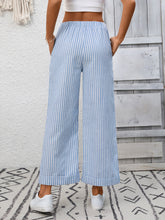 Light blue and white striped wide leg pants with a relaxed fit and cuffed hem for casual wear
