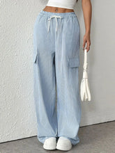 Light blue and white vertically striped wide leg corduroy cargo pants with a drawstring striped wide waistband