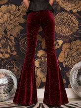 Deep red velvet high waist flared pants with subtle glittery texture ideal for elegant and stylish wear