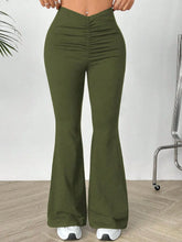 Olive green high waisted flare pants with ruched front and smooth stretchy fabric ideal for stylish wear