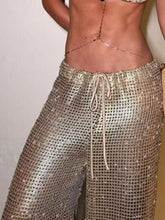 Shiny gold chainmail drawstring wide leg pants with a comfortable drawstring waistband for stylish wear