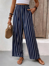 Navy blue and white striped wide leg pants with elastic waistband designed for comfort and easy care instructions