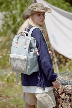 Eco-friendly waterproof canvas backpack bag in light blue and beige with pink handles