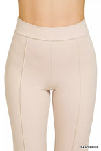 Sand beige heavy ponte pintuck pants with ribbed texture and elastic waistband for comfortable high-waisted wear