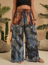 Full size tie-dye wide leg casual pants in deep blues grays and earthy browns with elastic waistband for plus size