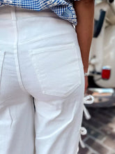 White denim bow-accented wide-leg pants with visible stitching details for a perfect fit and crisp finish