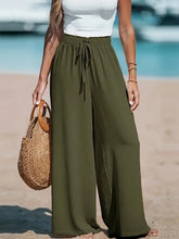 Olive green high-waisted drawstring wide-leg pants made from soft fabric for comfortable casual wear