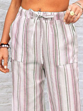 Full size striped wide leg pants in pastel pink green and white with a drawstring waistband for plus size wear