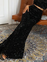 Black sequin embellished wide leg pants with a shimmering starry texture and flare silhouette