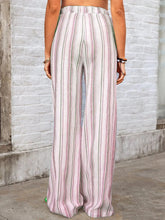 Full size striped wide leg pants in soft pink white and muted green on lightweight fabric for plus size wear