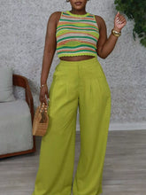 Vibrant lime green high waist wide leg flowy pants with a sleek pleated design for elegant comfort