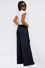 Black satin tied wide leg pants with high waist and side pockets featuring wide leg design