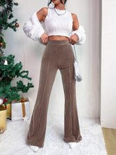 Brown corduroy high waist flare pants showcasing a stylish high waist design and flared leg silhouette