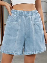 Light wash elastic waist denim shorts with patch pockets