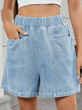 Light wash elastic waist denim shorts with patch pockets