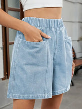 Light wash elastic waist denim shorts with patch pockets