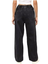 Black wide leg denim jeans with elastic waistband and two back pockets shown from the back side