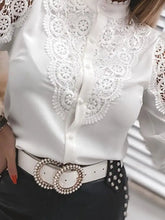 Elegant lace long sleeve white satin blouse with intricate lace detailing along the collar and sleeves