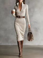 Elegant beige ribbed knit turtleneck midi sweater dress with deep V-neckline