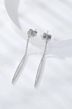 Elegant sterling silver drop earrings with baguette and round-cut diamonds