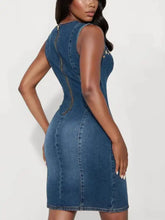 A fitted sleeveless denim dress in medium blue wash with visible stitching and back zipper detail