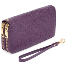 Purple floral embossed leather wallet with gold zippers and wrist strap