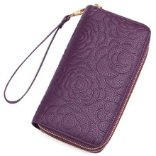 Purple embossed floral leather wallet with gold zipper and strap