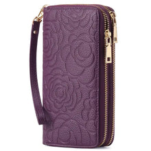 Purple floral-embossed leather wallet with gold zippers and wrist strap