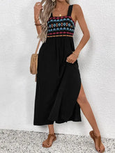 Embroidered black maxi dress with colorful bodice and side slit