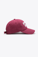 Maroon embroidered graphic baseball cap with white lettering