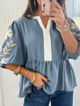 Light blue sleeve peplum blouse with white embroidered leaf pattern and contrasting white vertical front panel