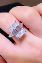 Emerald cut sterling silver ring with triangular side stones