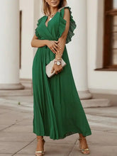Emerald green pleated dress with ruffled cap sleeves and V-neckline
