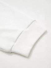 White ribbed knit sleeve cuff on exposed seam detail color block patch pocket drop shoulder sweatshirt machine wash cold