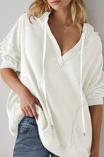 Womans white waffle knit exposed seam drawstring long sleeve hoodie