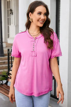 Women’s short-sleeve pink Henley tee with exposed seam and dropped shoulders