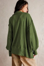 Oversized olive green exposed seam sweatshirt with side slit long sleeve