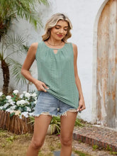 A light green eyelet cutout round neck tank with sleeveless design and delicate eyelet detailing