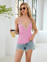 Pink lace-trimmed eyelet double strap cami with spaghetti straps made of lightweight fabric for casual wear