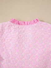Eyelet embroidered flutter sleeve blouse in pink floral pattern with ruffled neckline and contrast lace trim