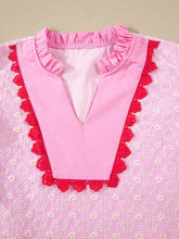 Pink eyelet embroidered flutter sleeve blouse with red lace trim and subtle floral pattern in v-neck design