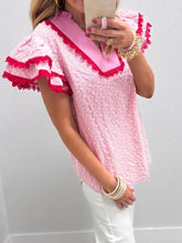 Pink eyelet embroidered flutter sleeve blouse with ruffled sleeves and contrasting red lace trim
