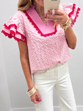Pink eyelet embroidered flutter sleeve blouse featuring lace trim ruffled sleeves with red contrast detailing