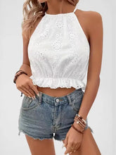 White eyelet embroidered ruffled halter top with a delicate ruffled hem cami detail for a feminine look