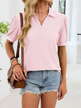 Pink eyelet blouse with puffed sleeves and a collar