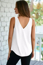White eyelet knit patterned loose v neck tank top featuring delicate lace design and breathable fabric